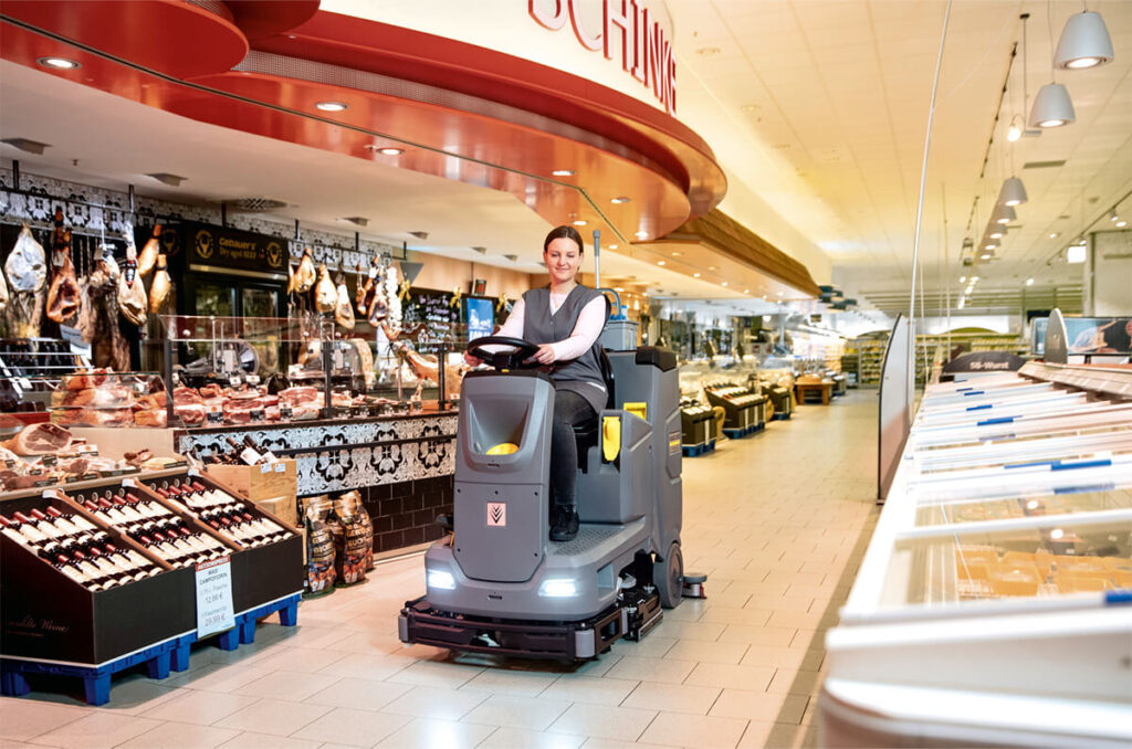 Woman riding B-110-R scrubber dryer