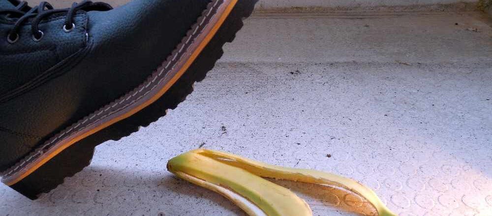 boot treading on a banana skin