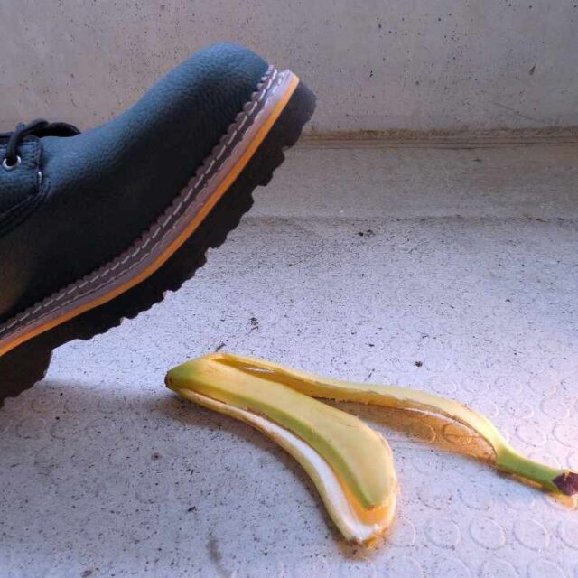 boot treading on a banana skin