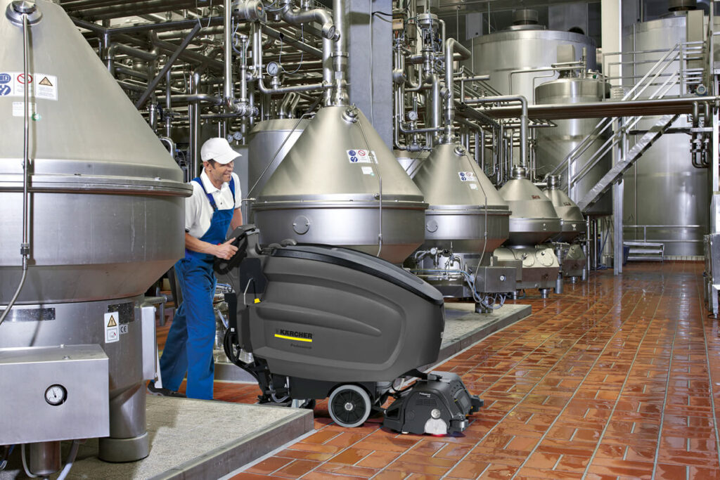 Man operating B 60/W Scrubber in factory