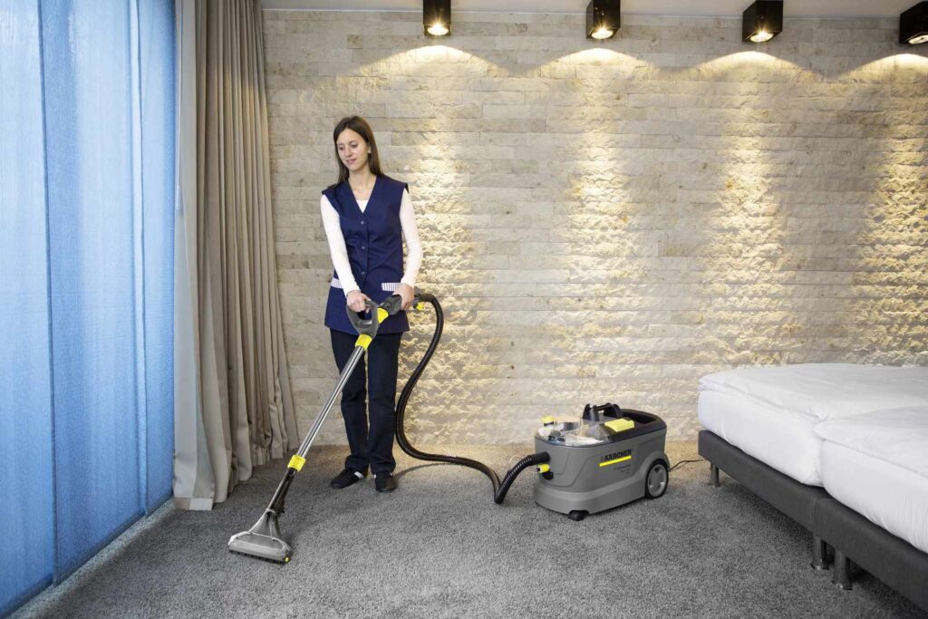 Puzzi 10/2 cleaning a hotel carpet