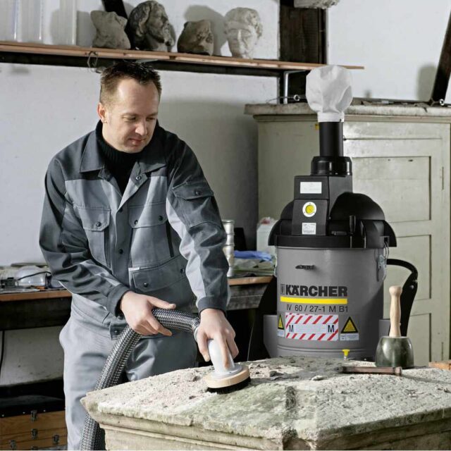 industrial vacuum cleaner clearing hazardous dust