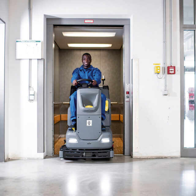 B110 R ride on floor scrubber in a lift