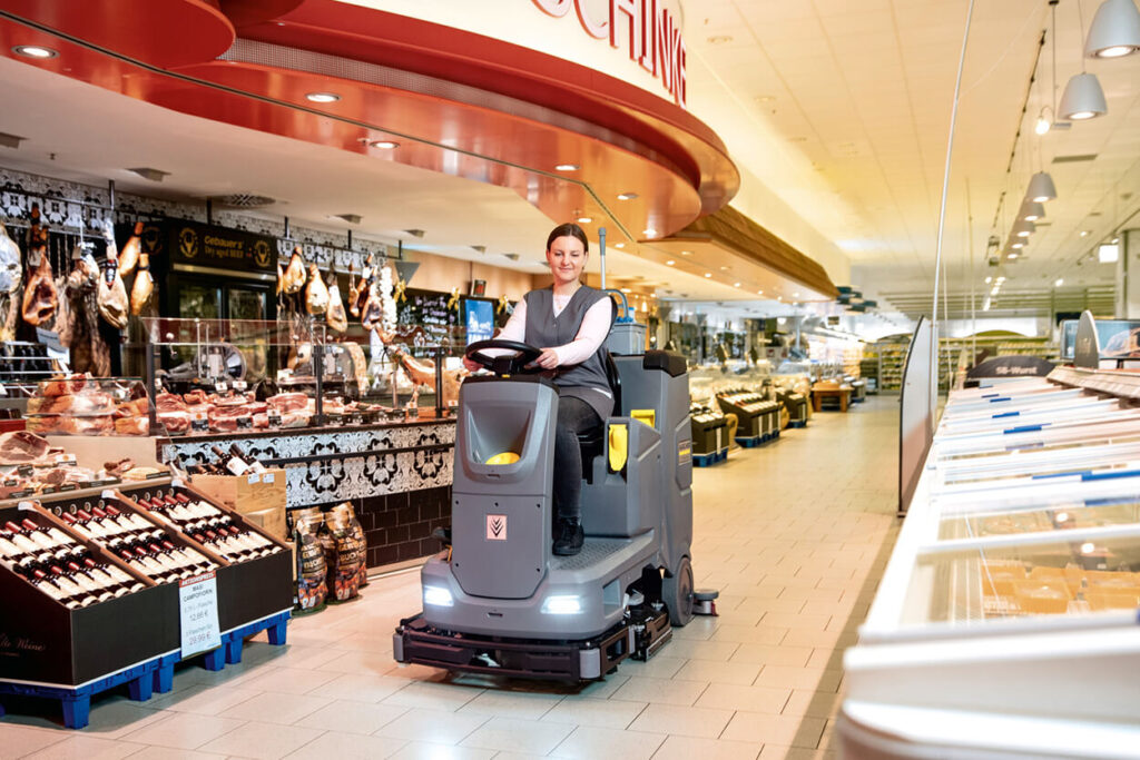 B110 R ride on floor scrubber in a supermarket