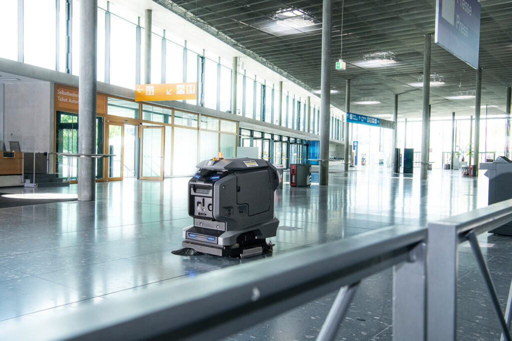 Kira B 50 Floor Scrubber moving across large empty airport hall