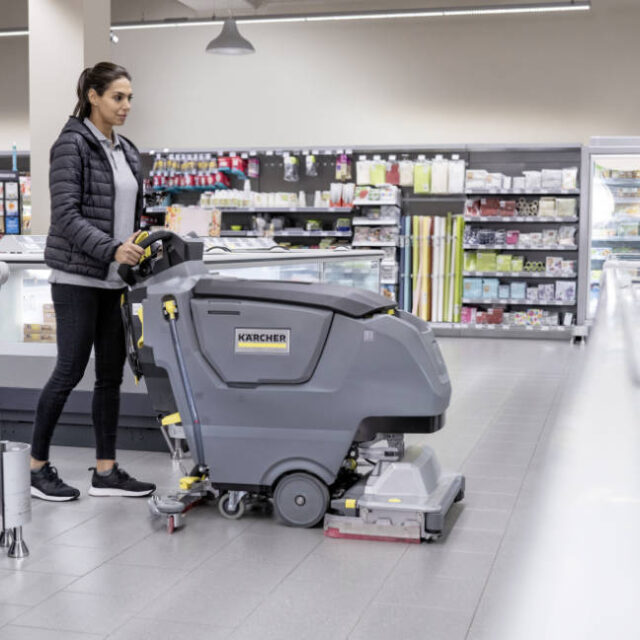 B 50 battery powered pedestrian scrubber dryer for hire cleaning floors in retail